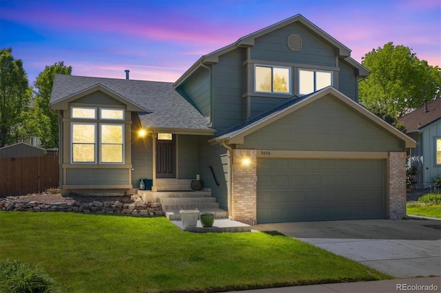 9494 Devonshire Pl, Highlands Ranch, CO 80126 - view of front of house with a shingled roof, driveway, brick siding, and an attached garage