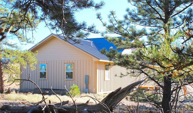 59 Whip Way, Hartsel, CO 80449 - view of property exterior with board and batten siding and metal roof