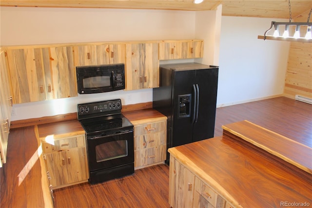 59 Whip Way, Hartsel, CO 80449 - kitchen featuring black appliances, light brown cabinetry, wooden counters, dark wood-style floors, and pendant lighting