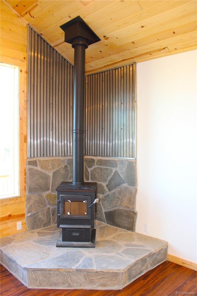59 Whip Way, Hartsel, CO 80449 - detailed view of a wood stove, wood finished floors, wooden ceiling, and baseboards