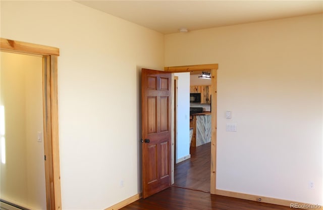 59 Whip Way, Hartsel, CO 80449 - unfurnished room featuring dark wood-style floors, baseboards, and a smoke detector