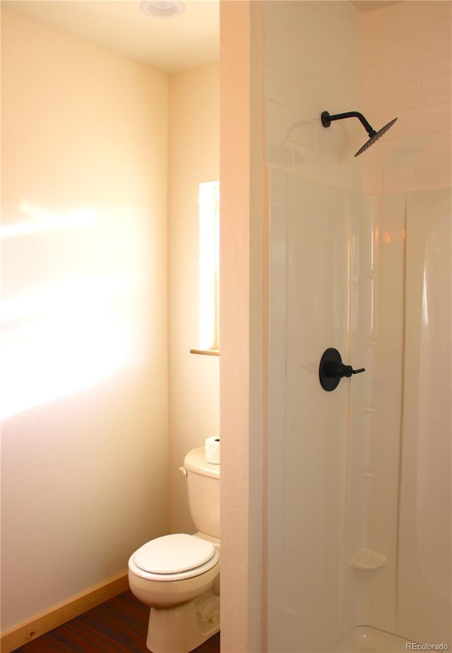 59 Whip Way, Hartsel, CO 80449 - bathroom with toilet, a shower, and wood finished floors