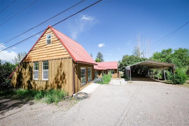 view of front of property featuring a carport