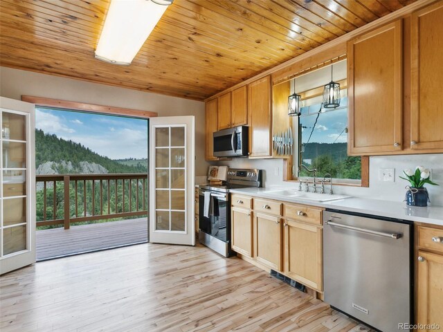6066 Crawford Gulch Rd, Golden, CO 80403 - kitchen featuring stainless steel appliances, a sink, wooden ceiling, light countertops, and decorative light fixtures