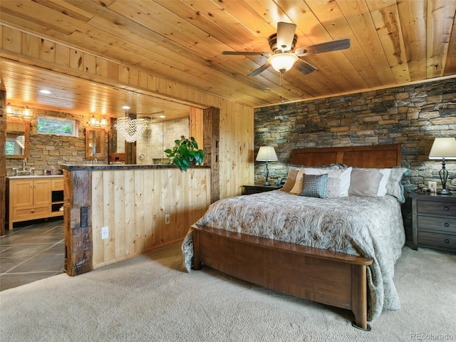 6066 Crawford Gulch Rd, Golden, CO 80403 - bedroom featuring wood ceiling, carpet flooring, wood walls, and a sink