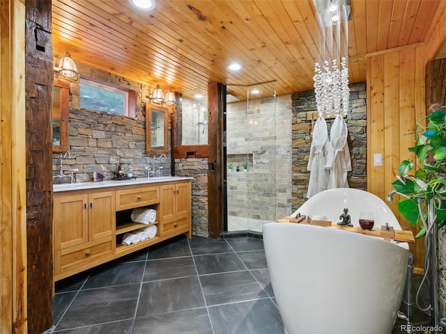 6066 Crawford Gulch Rd, Golden, CO 80403 - bathroom with wooden ceiling, double vanity, a soaking tub, tile patterned floors, and recessed lighting