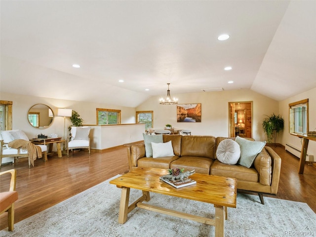 6066 Crawford Gulch Rd, Golden, CO 80403 - living area featuring lofted ceiling, a baseboard heating unit, a chandelier, wood finished floors, and baseboards