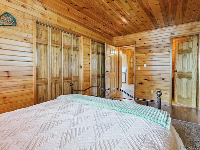 6066 Crawford Gulch Rd, Golden, CO 80403 - bedroom featuring wood walls, wood finished floors, multiple closets, and wooden ceiling