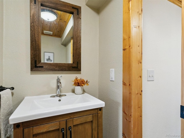 6066 Crawford Gulch Rd, Golden, CO 80403 - bathroom featuring vanity and a textured wall