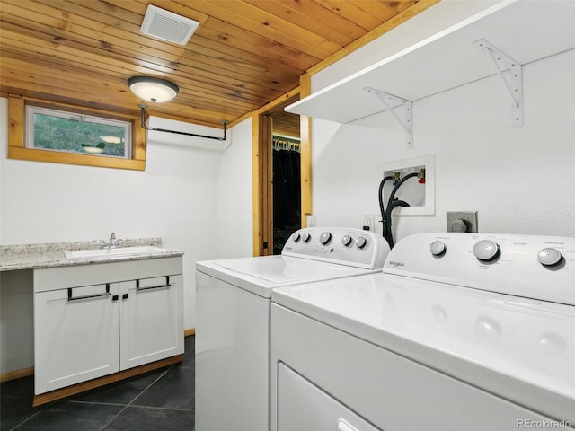 6066 Crawford Gulch Rd, Golden, CO 80403 - washroom featuring independent washer and dryer, a sink, wooden ceiling, and dark tile patterned floors