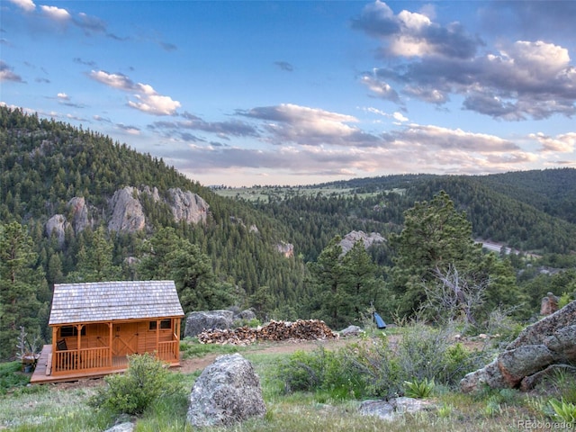 6066 Crawford Gulch Rd, Golden, CO 80403 - mountain view with a heavily wooded area