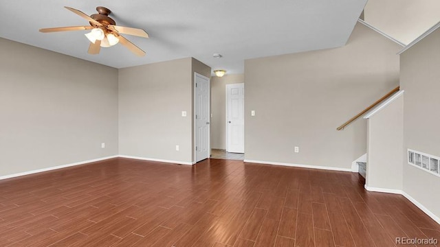 5483 Ben Park Cir, Parker, CO 80134 - unfurnished living room with stairs, a ceiling fan, and wood finished floors