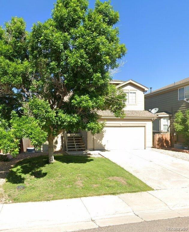 5483 Ben Park Cir, Parker, CO 80134 - view of front facade featuring a garage, stairway, and concrete driveway
