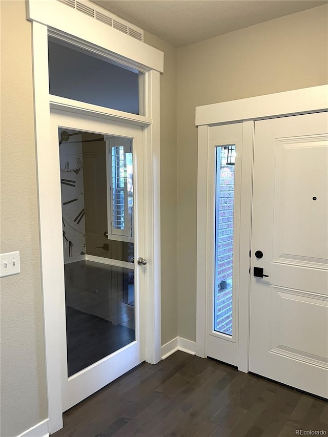 entryway featuring dark wood-type flooring