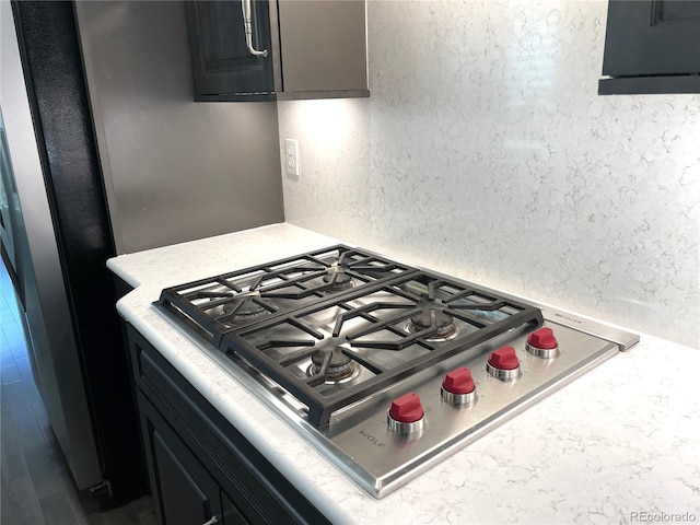 kitchen featuring tasteful backsplash and stainless steel gas stovetop