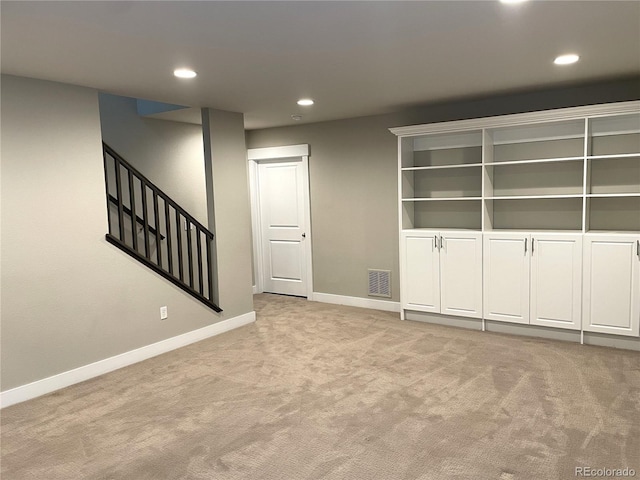 unfurnished living room with light carpet