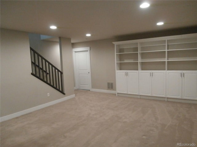 basement with light colored carpet