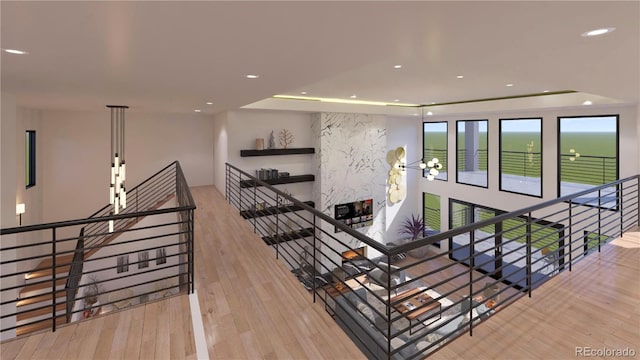 6834 S Ensenada St, Aurora, CO 80016 - stairs with wood finished floors, recessed lighting, and a raised ceiling
