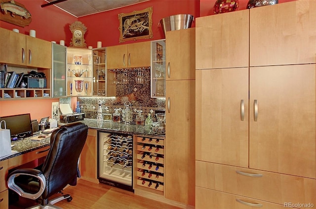 home office featuring bar and light hardwood / wood-style flooring