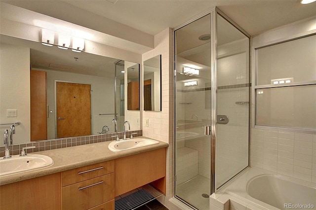 bathroom with independent shower and bath, vanity, tile patterned flooring, and decorative backsplash