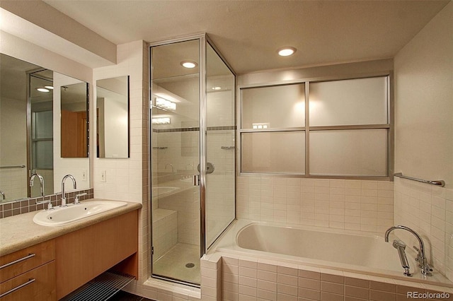 bathroom featuring vanity and plus walk in shower