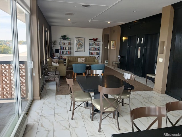 4570 E Yale Ave Unit 706, Denver, CO 80222 - dining area featuring visible vents, marble finish floor, and a wealth of natural light