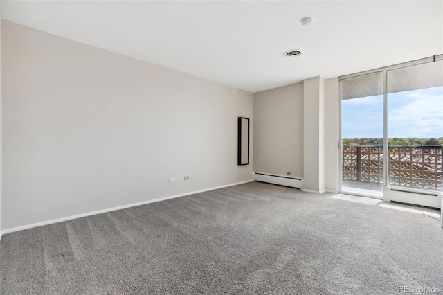 4570 E Yale Ave Unit 706, Denver, CO 80222 - empty room with a baseboard heating unit, expansive windows, baseboards, and carpet