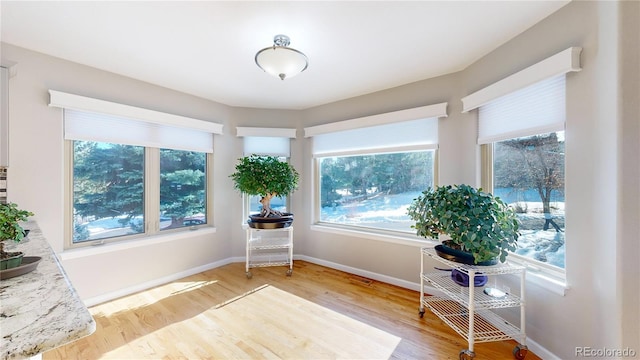 sitting room featuring light wood-style flooring and baseboards