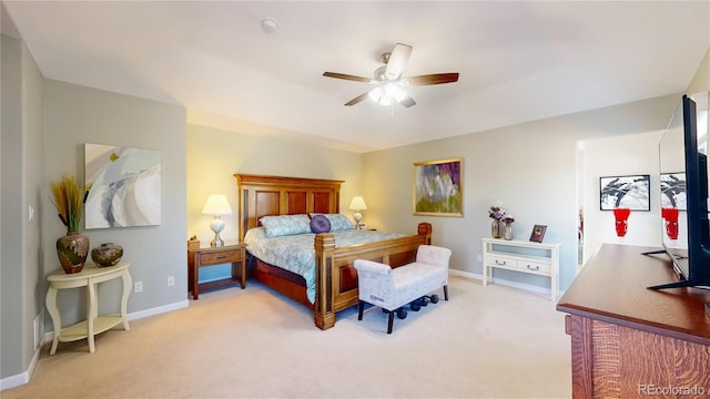 bedroom with baseboards, light colored carpet, and a ceiling fan