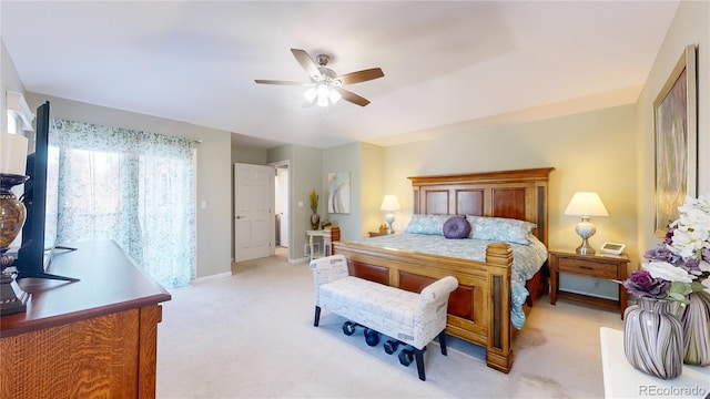 bedroom with baseboards, light colored carpet, and ceiling fan