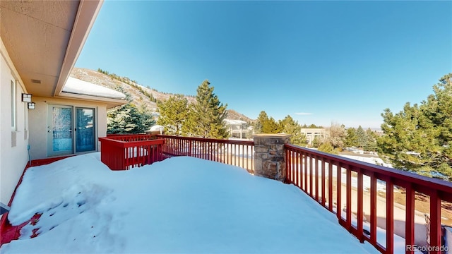 view of snow covered deck