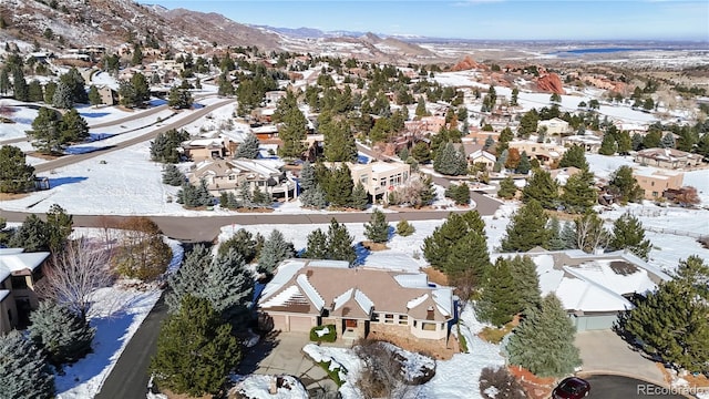 birds eye view of property featuring a mountain view and a residential view