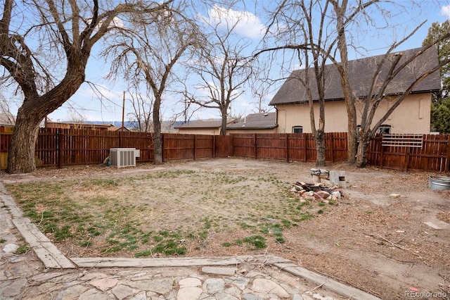 view of yard featuring a fenced backyard and cooling unit