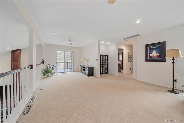 living area featuring light carpet, a ceiling fan, baseboards, recessed lighting, and visible vents