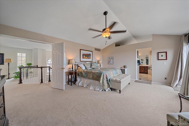 carpeted bedroom featuring a ceiling fan, baseboards, visible vents, and lofted ceiling