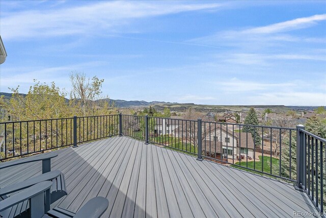 wooden deck featuring a mountain view