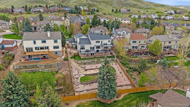 birds eye view of property featuring a residential view and a mountain view
