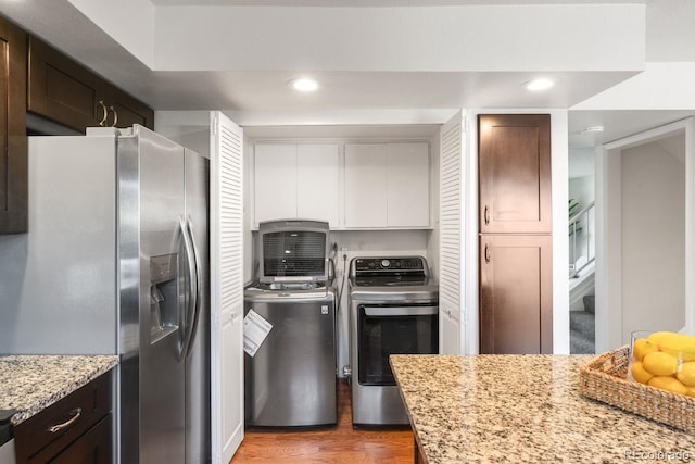 12648 W Virginia Ave, Lakewood, CO 80228 - kitchen with light stone countertops, stainless steel fridge with ice dispenser, washer / clothes dryer, recessed lighting, and wood finished floors
