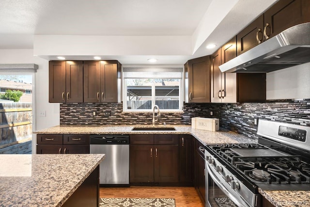 12648 W Virginia Ave, Lakewood, CO 80228 - kitchen featuring plenty of natural light, a sink, appliances with stainless steel finishes, and under cabinet range hood