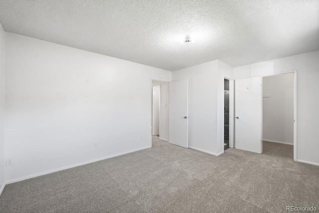12648 W Virginia Ave, Lakewood, CO 80228 - unfurnished bedroom with carpet floors, a textured ceiling, baseboards, and a closet