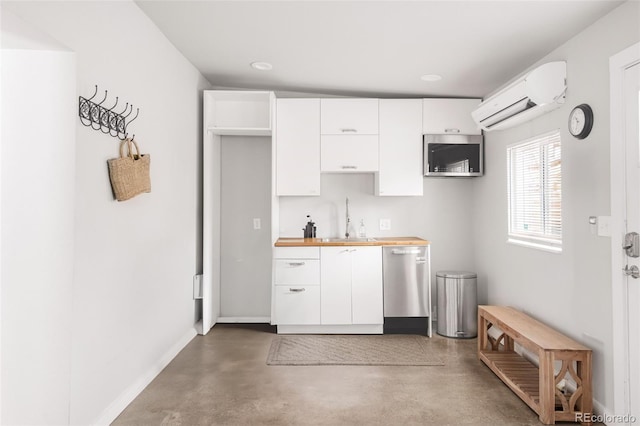 kitchen with a wall unit AC, a sink, white cabinets, concrete flooring, and dishwasher