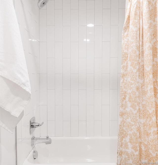 bathroom with shower / bathtub combination with curtain