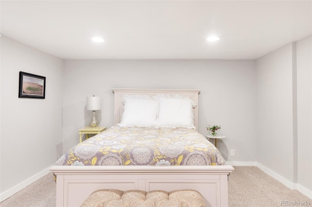 carpeted bedroom featuring baseboards and recessed lighting