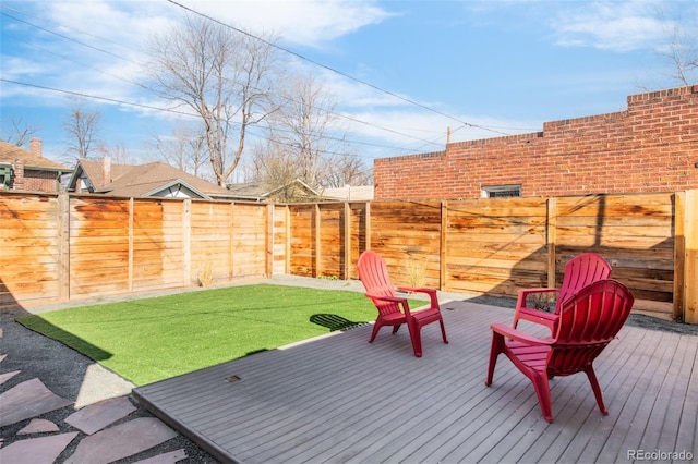 exterior space featuring a lawn and a fenced backyard