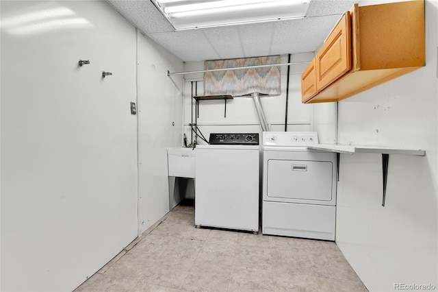 laundry room featuring cabinet space and washer and clothes dryer