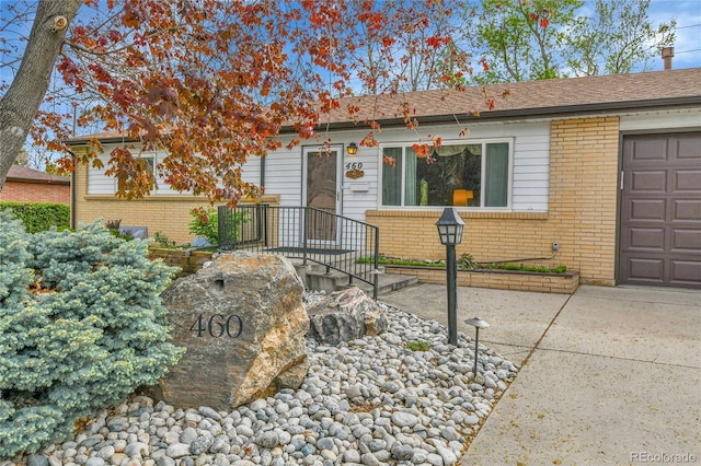 view of front of home with brick siding