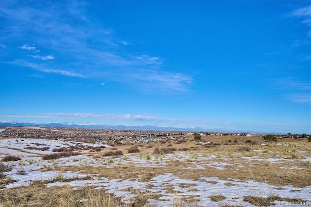 view of landscape featuring a mountain view