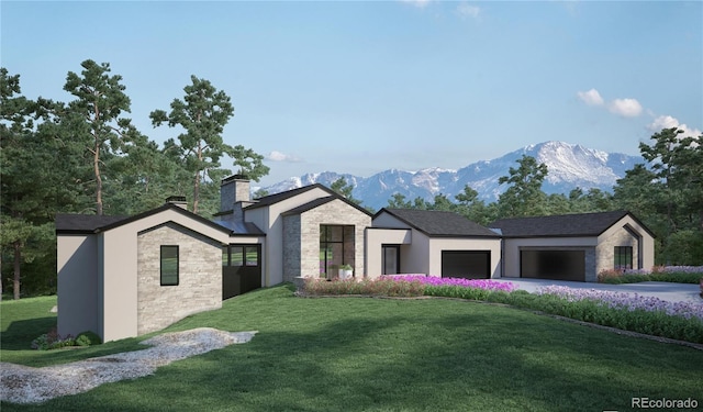 view of front facade with a mountain view, a garage, and a front yard