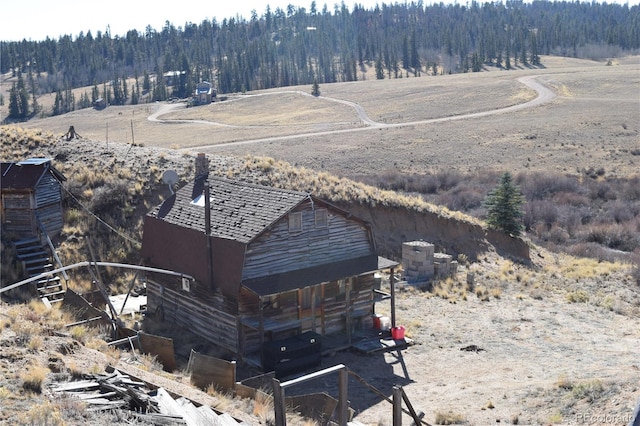 birds eye view of property featuring a rural view