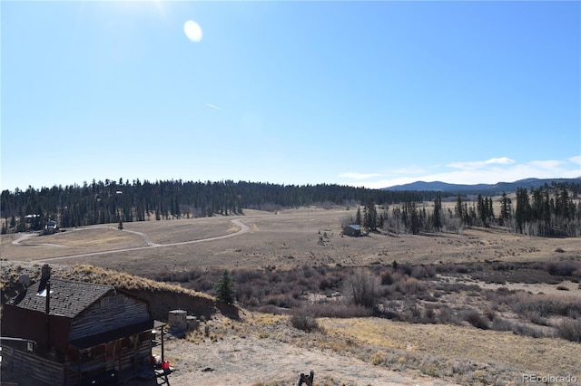 property view of mountains featuring a rural view